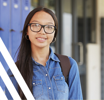 asian girl with glasses against backdrop of blue lockers